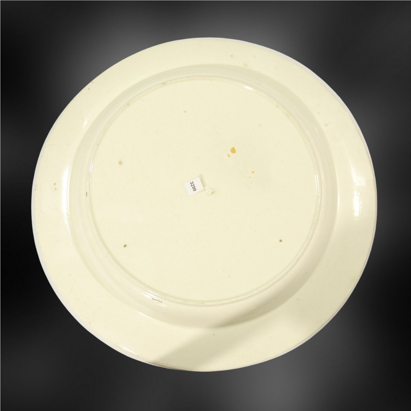 Plate: Ship with furled mainsail, flying British flag.