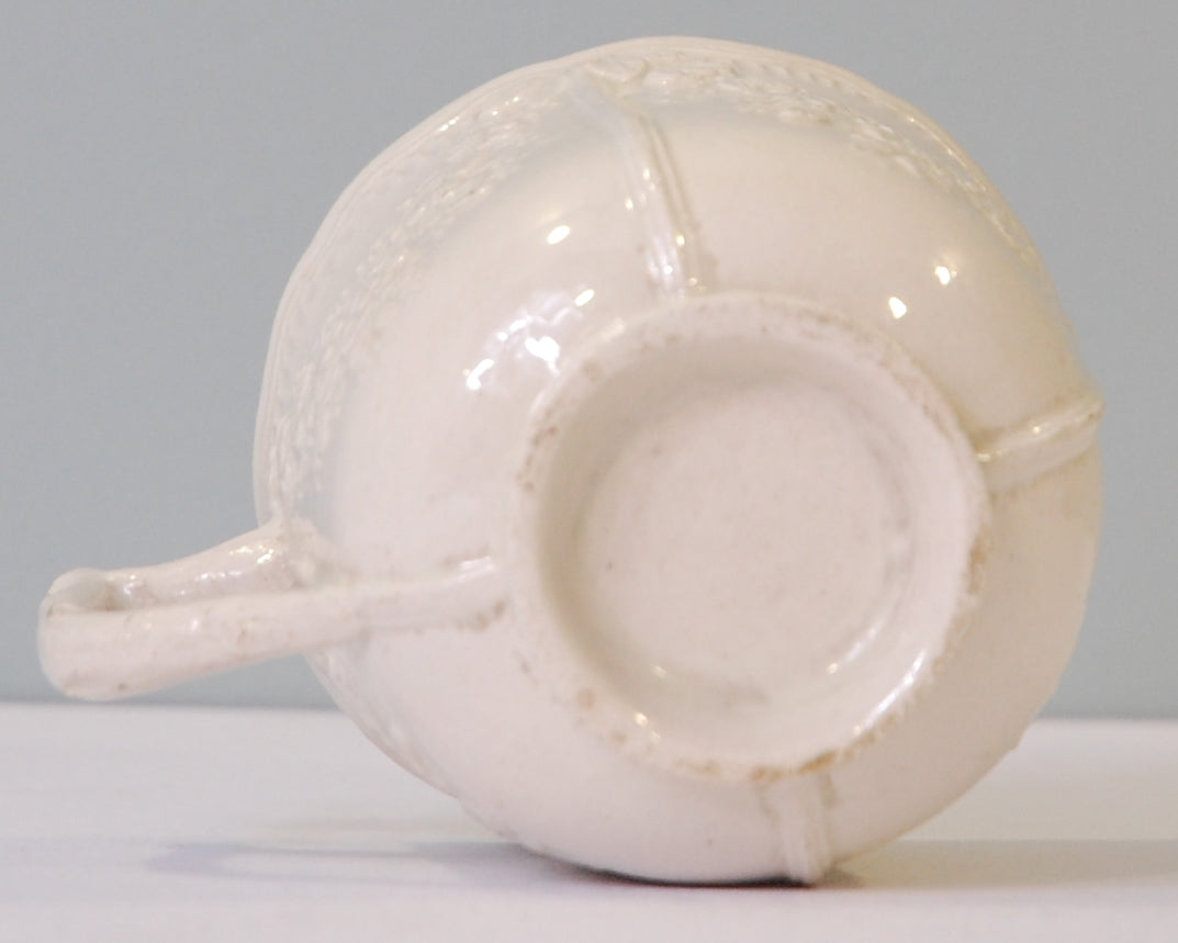 Creamware cup; Garlands; twig handle