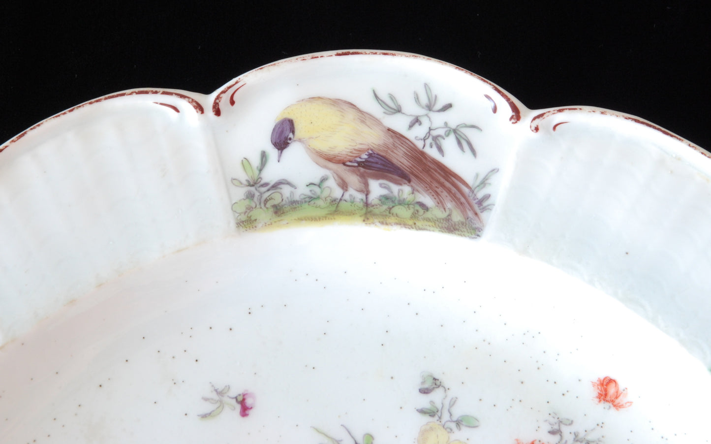 Pair plates, scalloped and flowers. Birds around the edge.