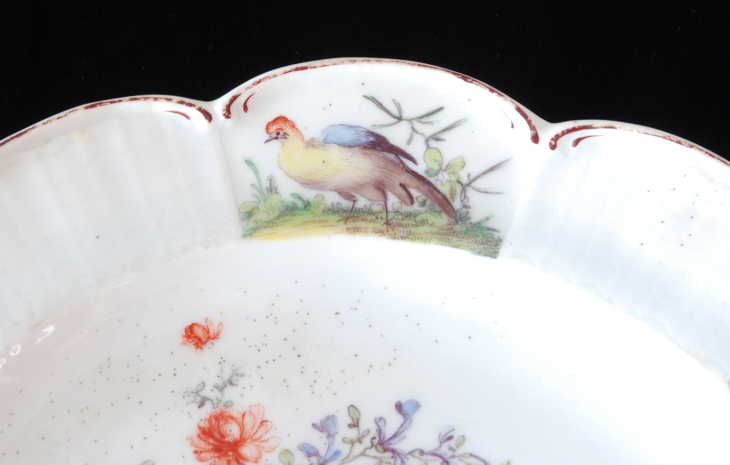 Pair plates, scalloped and flowers. Birds around the edge.