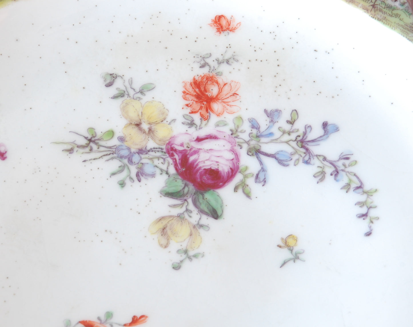 Pair plates, scalloped and flowers. Birds around the edge.