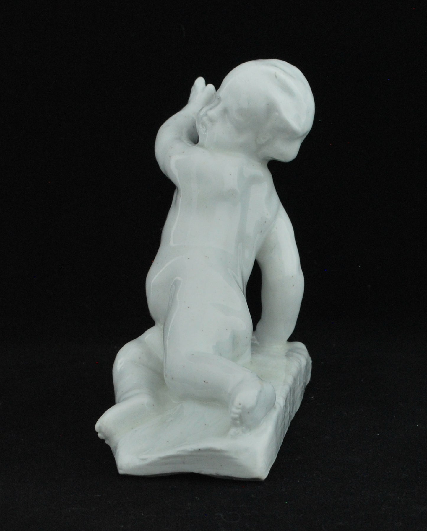 Reclining cherub