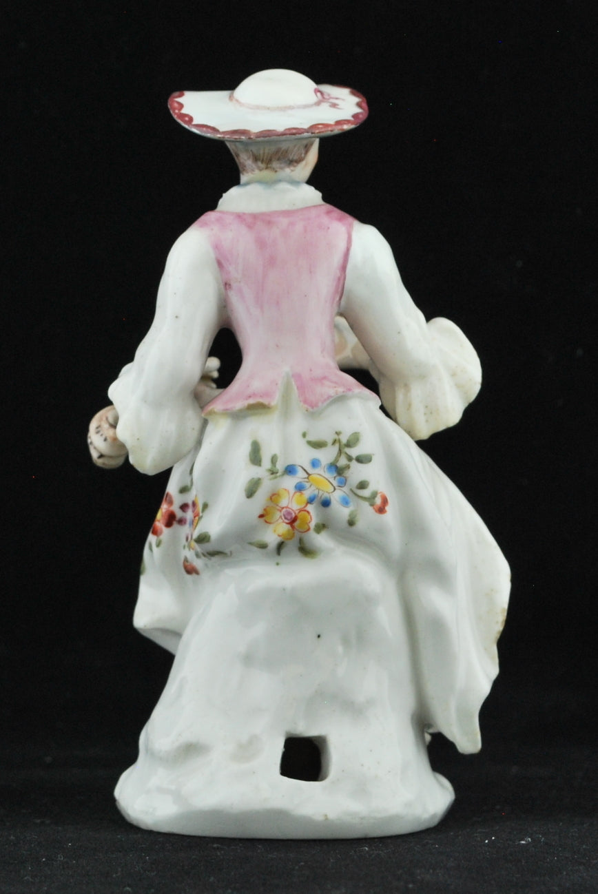 Columbine, playing her hurdy-gurdy