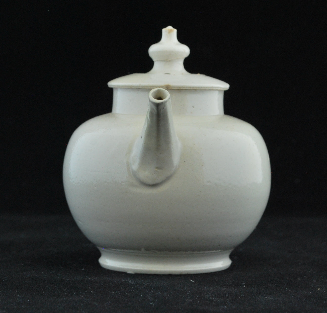 Small white teapot