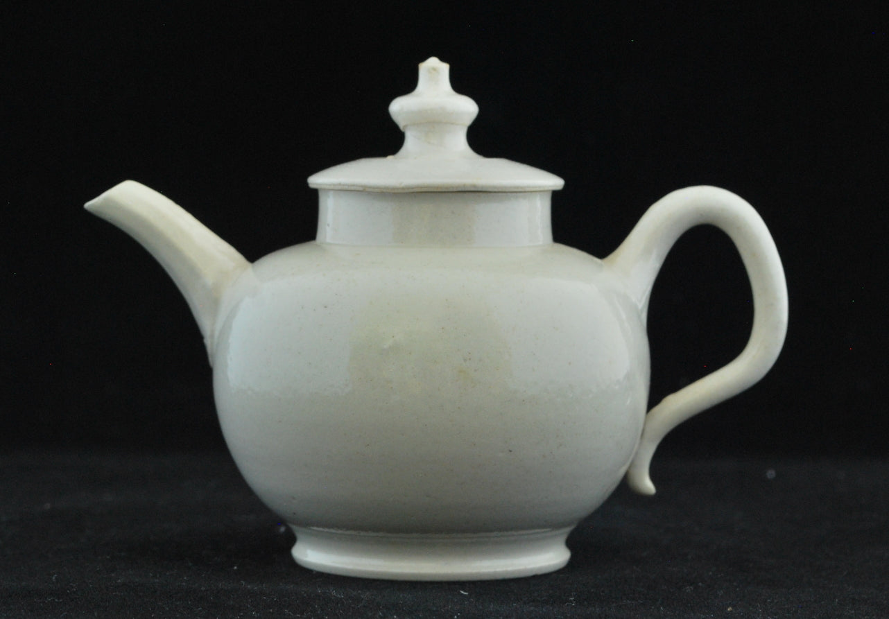 Small white teapot