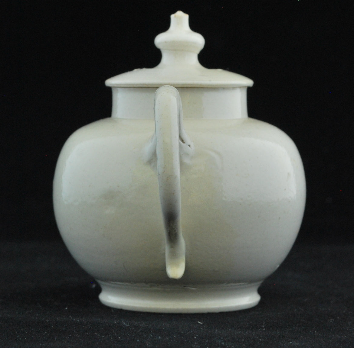 Small white teapot