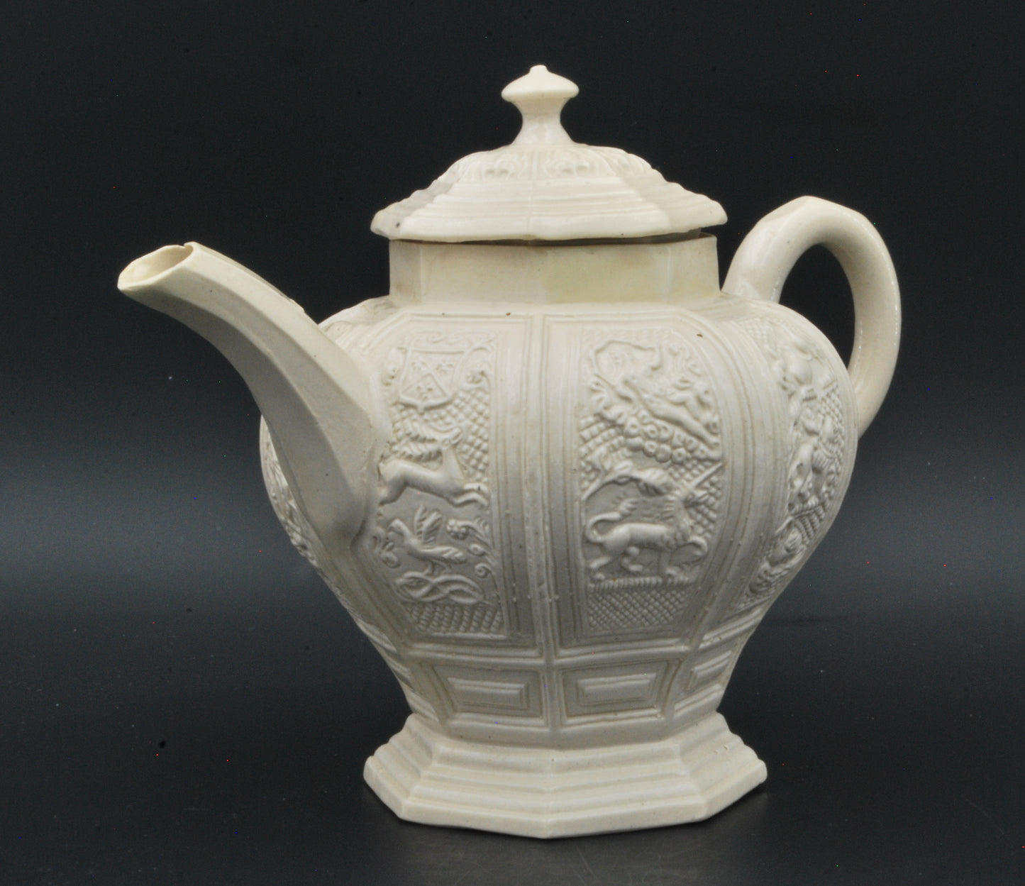 Baluster form saltglaze teapot. Beasts.