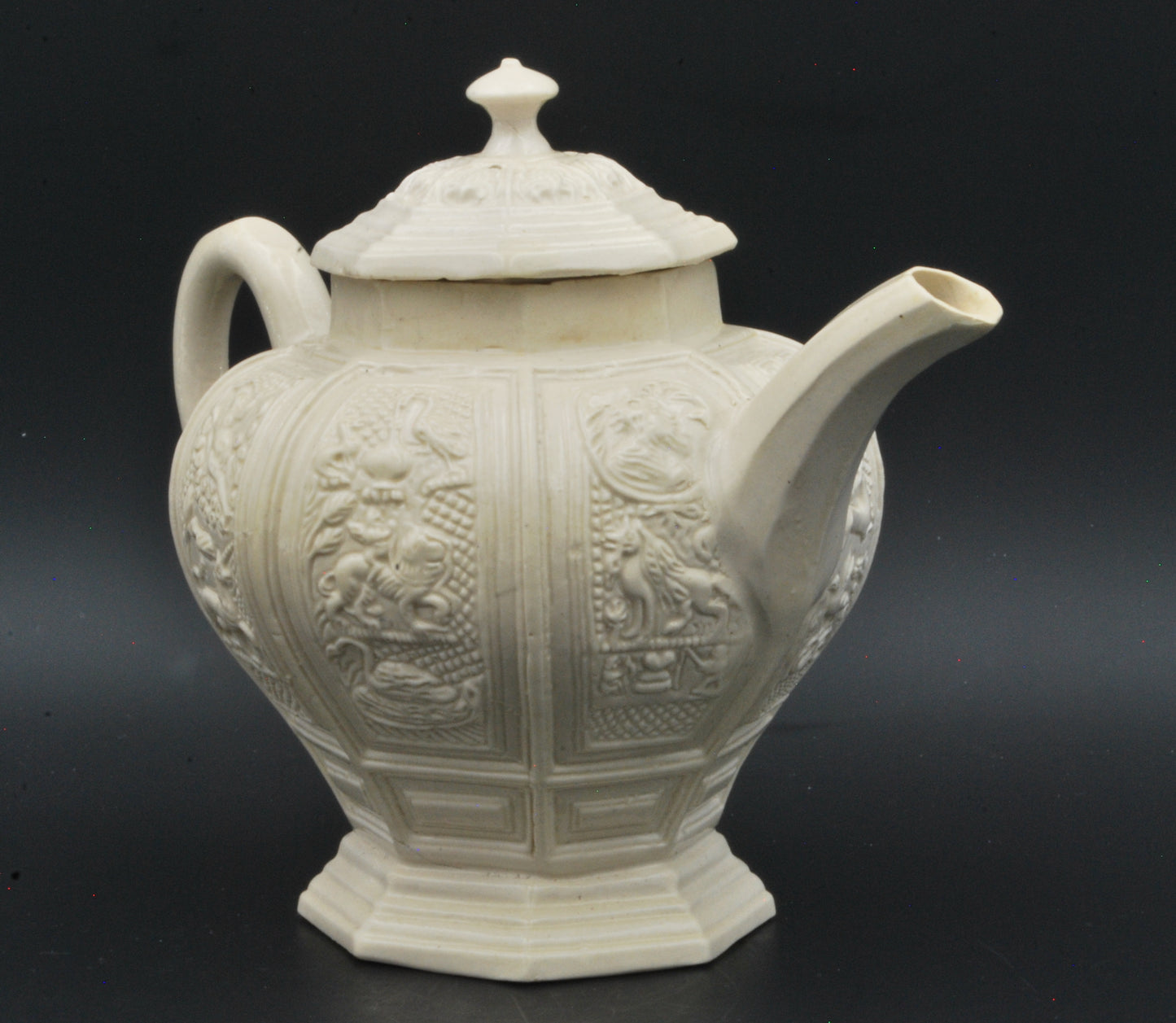 Baluster form saltglaze teapot. Beasts.