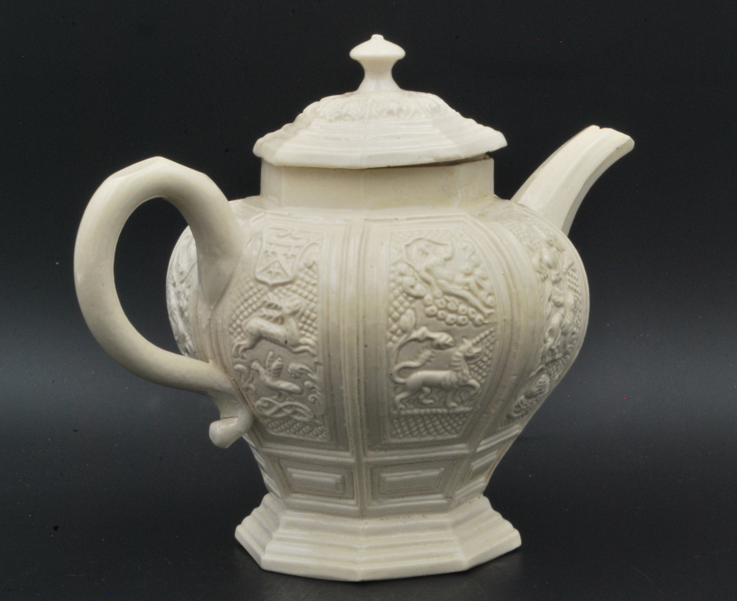 Baluster form saltglaze teapot. Beasts.