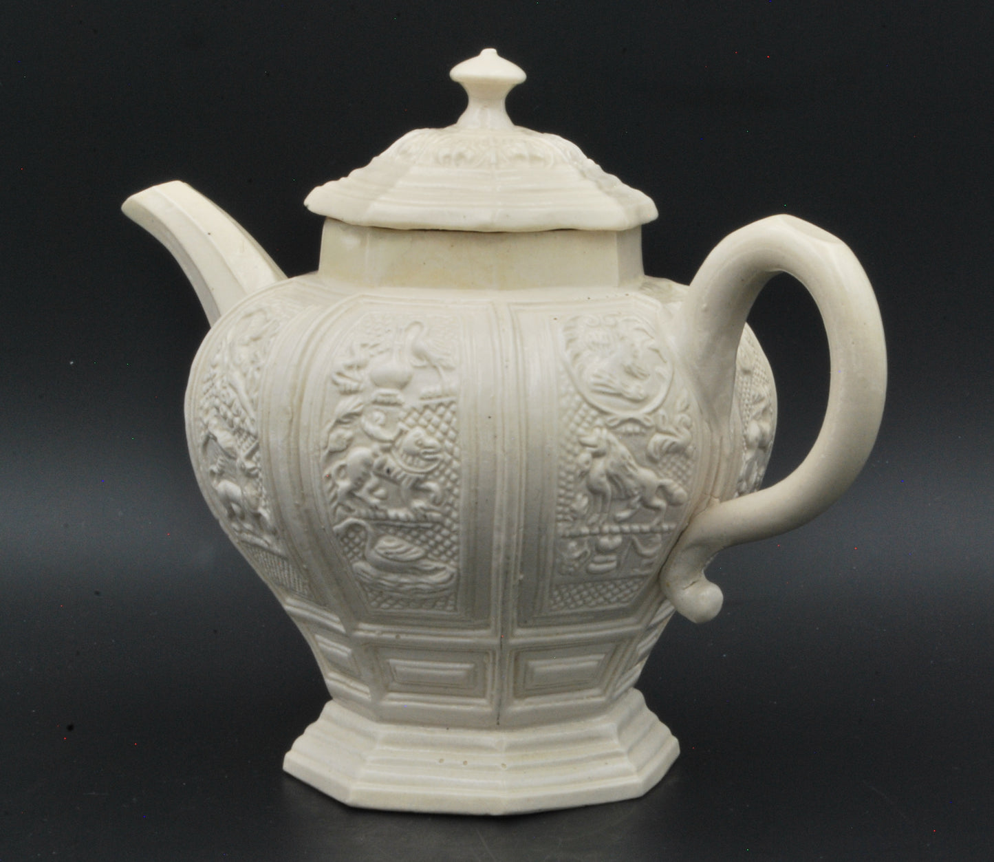 Baluster form saltglaze teapot. Beasts.