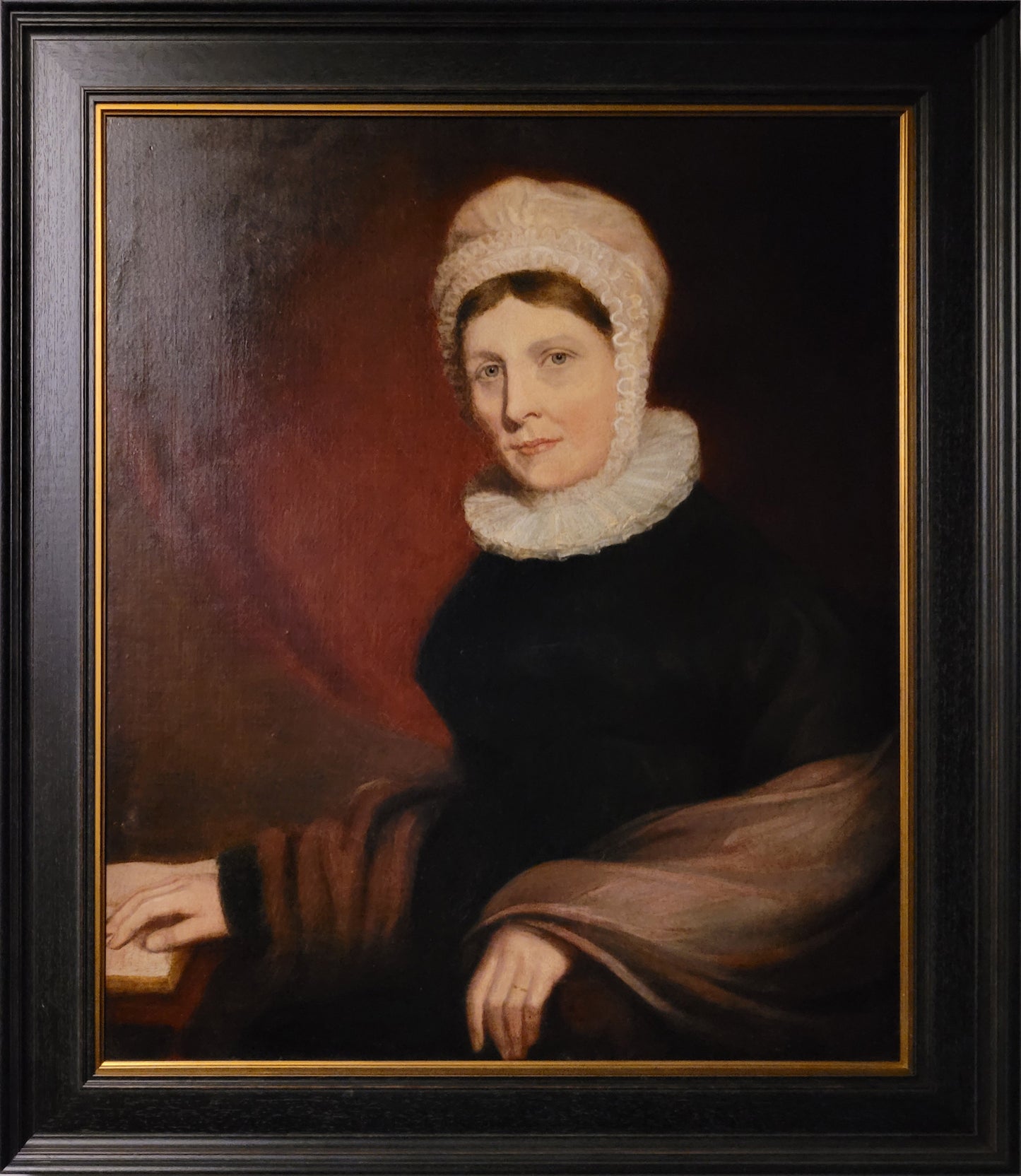 Portrait of a woman in ruffle and frilled cap