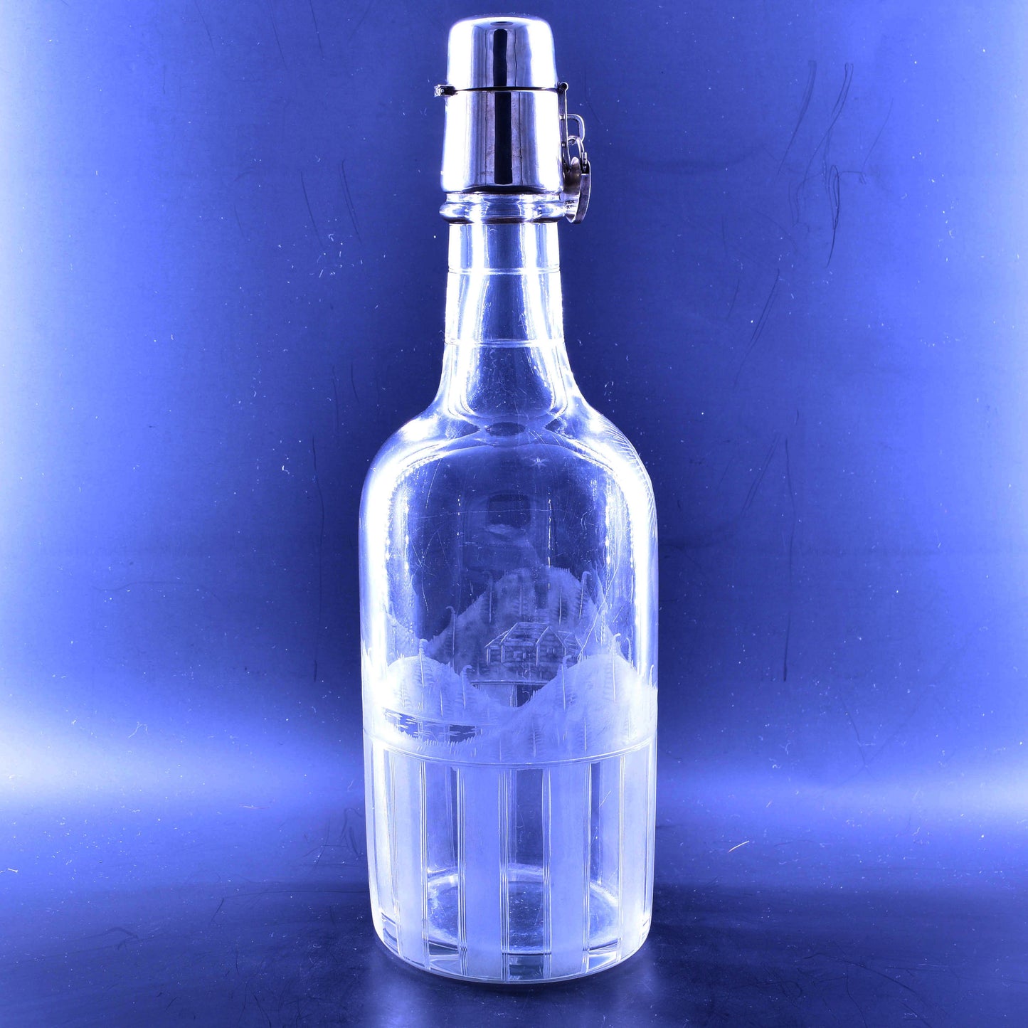 Tantalus decanter with engraving and silver lock.