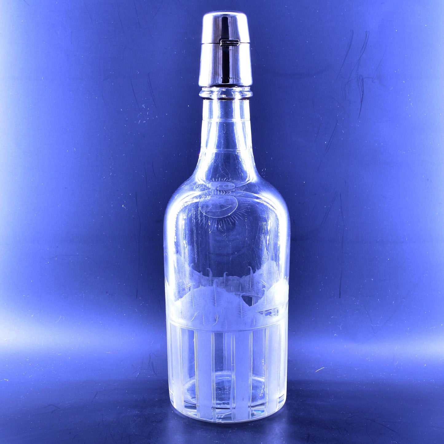 Tantalus decanter with engraving and silver lock.