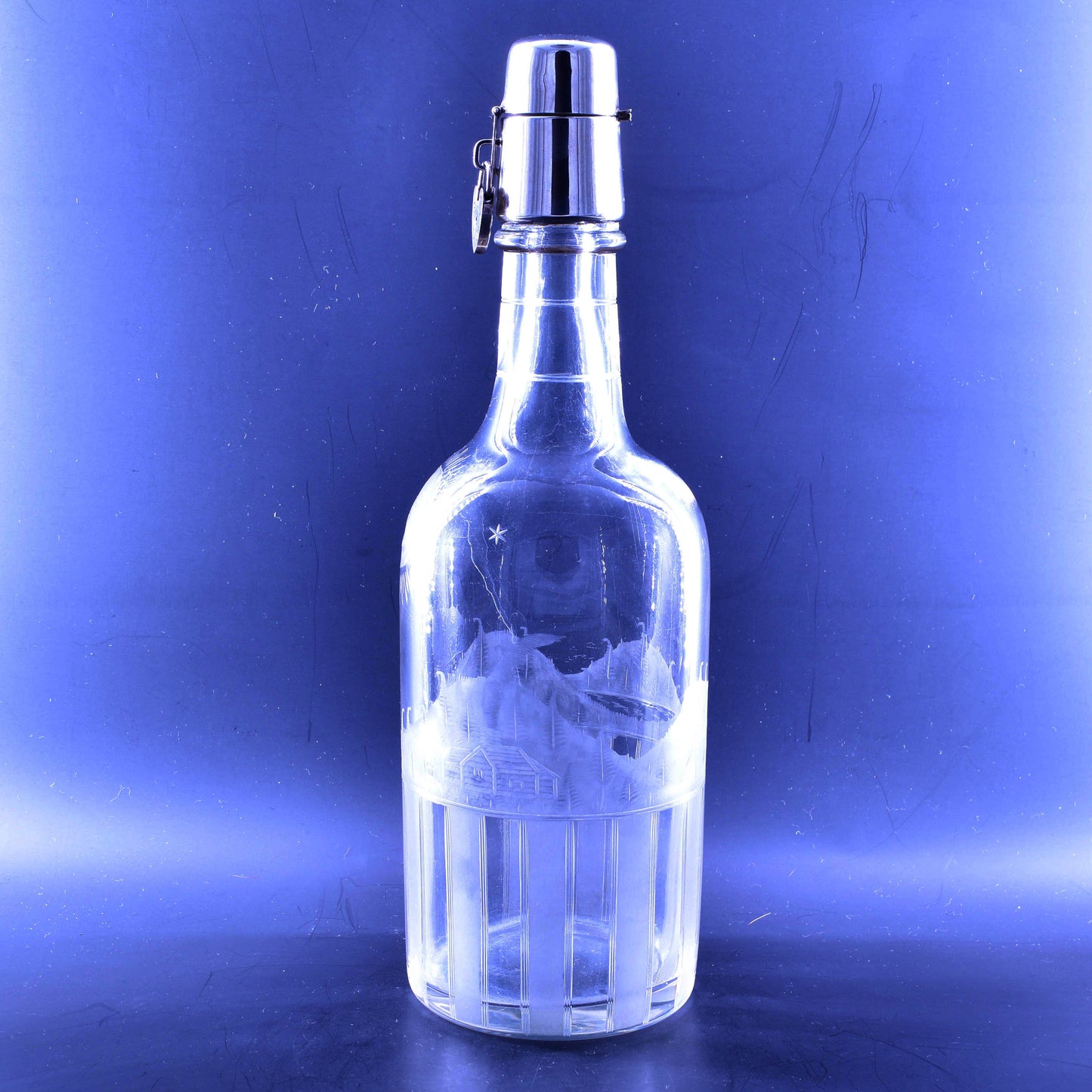 Tantalus decanter with engraving and silver lock.