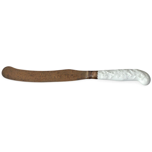 Knife, white, raised anchor period. Prunus.
