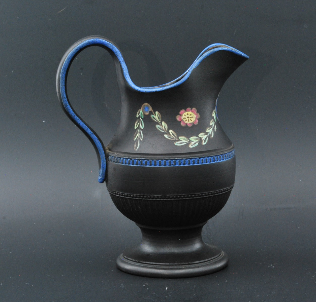 Silver shaped jug with painting