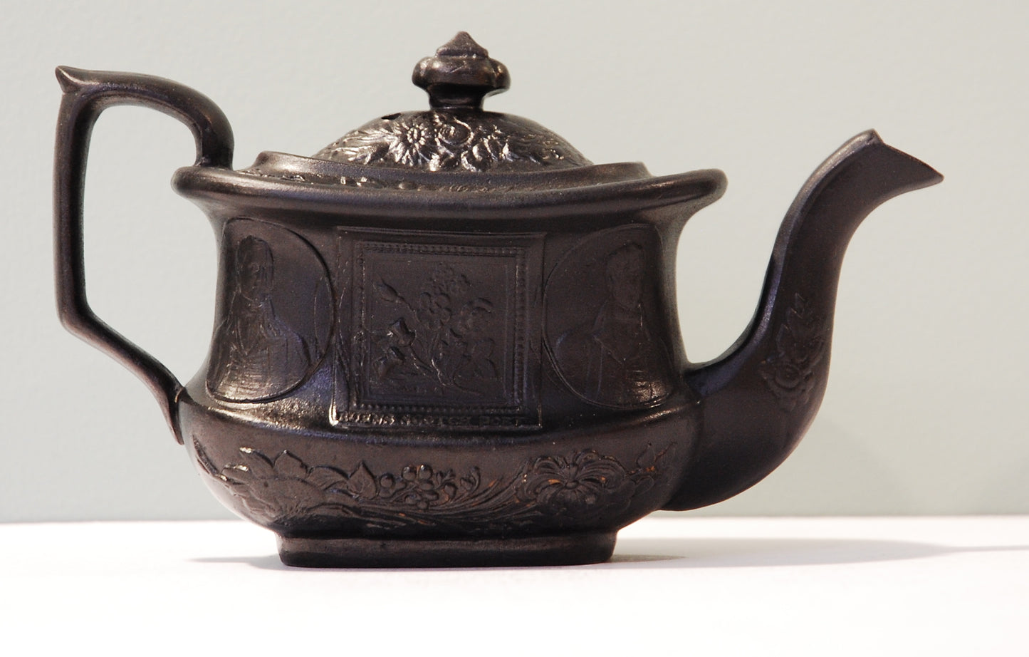 Robert Burns teapot. Black lustre.