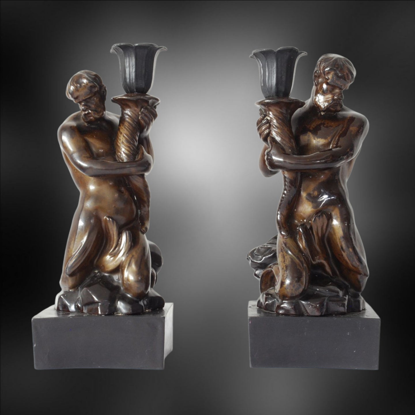 Pair Triton Candlesticks, bronzed