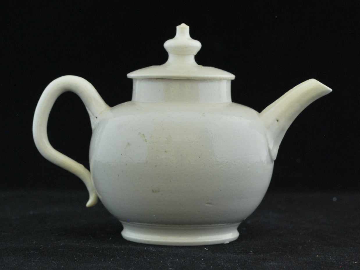 Small white teapot